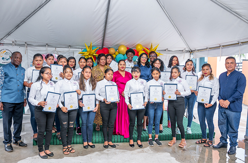 First Lady, Mrs. Arya Ali; Minister of Public Service, Sonia Parag and other officials with the 20 graduates of the Basic Safety Training (BST) and Ship Security Awareness Training, on Saturday (Delano Williams photo)