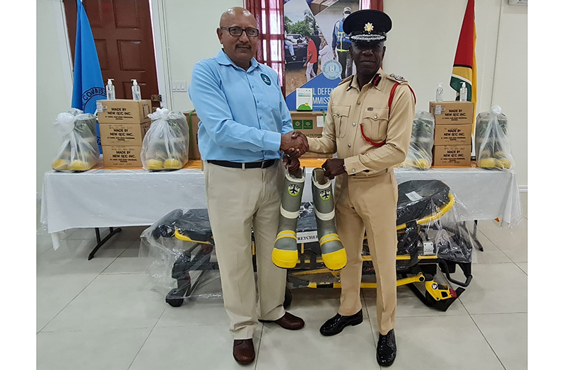 Director General of the CDC, Colonel (Ret’d) Nazrul Hussain, hands over supplies to Chief Fire Officer, Gregory Wickham (CDC photos)