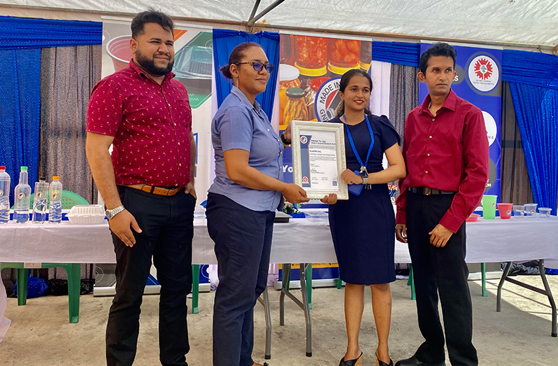 GNBS Head of Marketing, Syeid Ibrahim (left) and Head of Certification Services, Andrea Mendonca (second left) handing over the certificate to Plastific Inc, CEO  Vivekanand Ganesh and Assistant Manager, Togeshwarie Ganesh (second right)