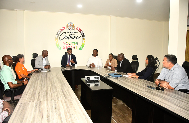 Minister of Culture, Youth & Sport, Charles Ramson Jr. (centre) speaking with the new GOA executives following their courtesy call (Adrian Narine photo)