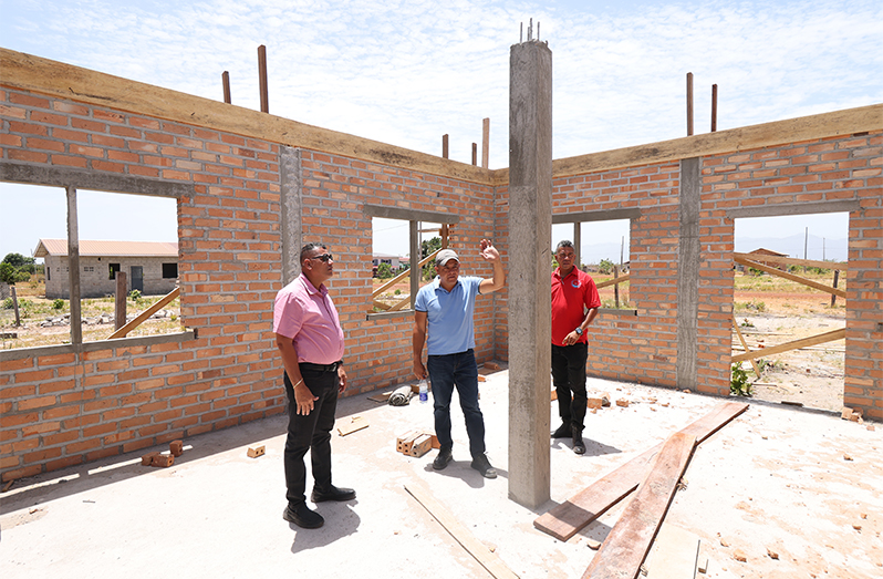 Minister of Housing and Water Collin Croal inspected housing units being constructed through the Lethem Housing Support Programme