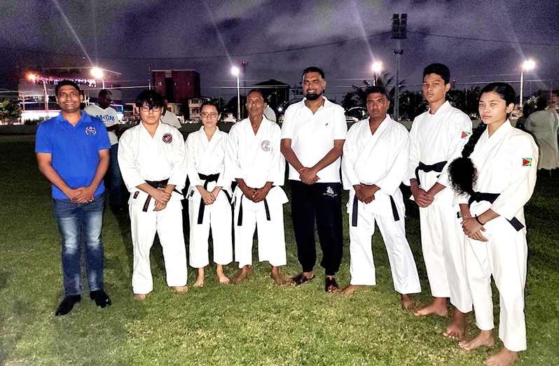 H.E. Dr Mohamed Irfaan Ali ( fourth from right) stands with Senior Instructor of the IKO Guyana Jeffrey Wong (fifth from right) and students.