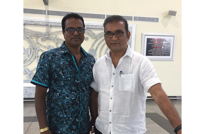 Abhijeet (right) with the Trinidadian promoter