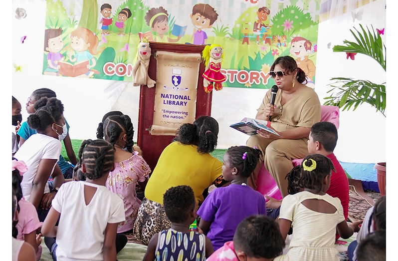 Minister of Education Priya Manickchand reading Dr. Suess’ “Cat in the Hat” to the children