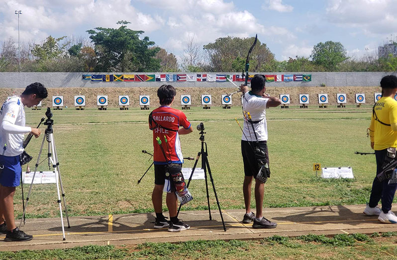 Guyana’s Devin Permaul retrieving his arrows at the target during the Ranking Rounds