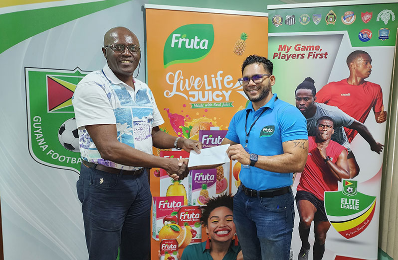 From left Ian Alves, General Secretary-GFF and Fharis Hamid, Marketing Manager , Guyana Beverages Inc.