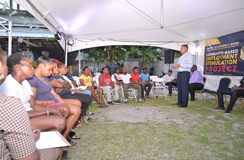Minister of Housing and Water, Collin Croal, addressing residents