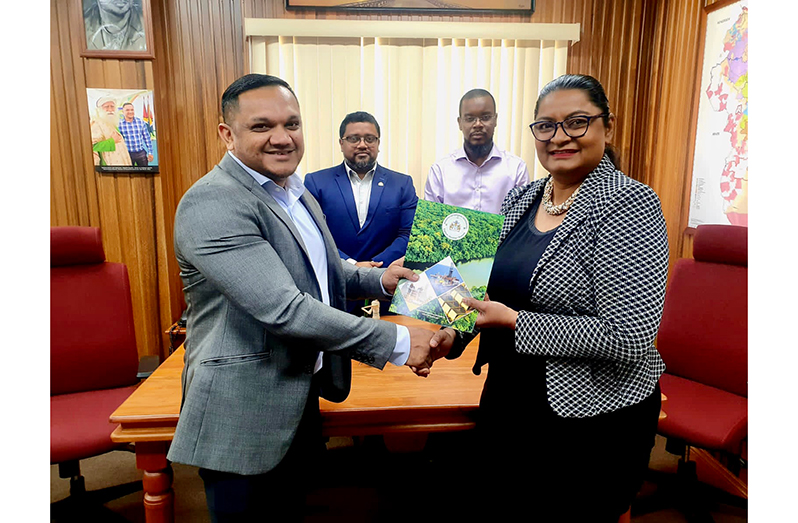 Minister of Natural Resources, Vickram Bharrat hands over the signed Letter of Approval to Noble Drilling’s Local Content Manager, Renatha Khan – Bovell