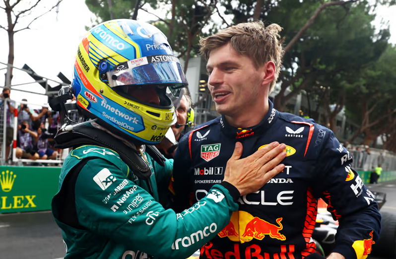 Max Verstappen (right) is congratulated by Fernando Alonso