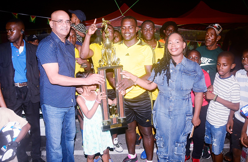 Vice President Bharrat Jagdeo hands over the winner’s trophy to Back Circle