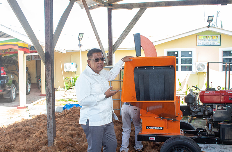 Minister of Agriculture, Minister Zulfikar Mustapha, inspects the coconut fibre machine at Hope Estate