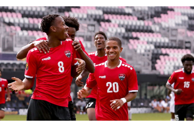 Ajani Fortune (#8) celebrates his goal against St Kitts and Nevis on Sunday.