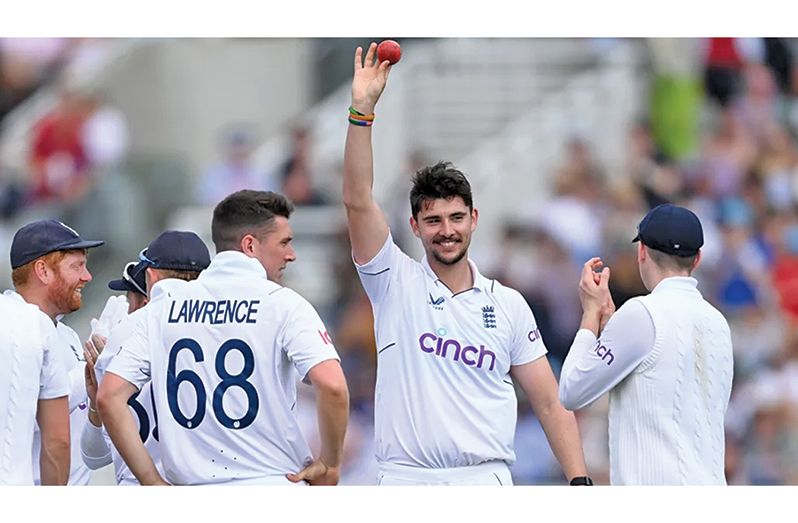 Josh Tongue holds the ball aloft for his five-for  •  (Getty Images)