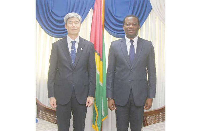 MINISTER of Foreign Affairs and International Co-operation, Hugh Todd with President of the National Institute of Forest Science of the Republic of Korea, Dr. Jae Soo Bae