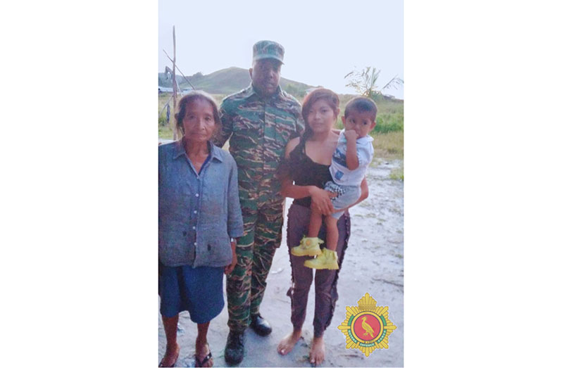 The joyous reunion showing Jerine George, Cenoriza George and her two-year-old son Vel George, and the GDF medical personnel who provided assistance during the ordeal