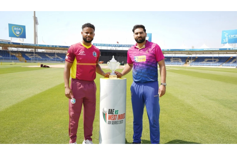 West Indies captain, Shai Hope (left) and UAE captain, Muhammad Wassem, pose with the series trophy (CWI Media photo)