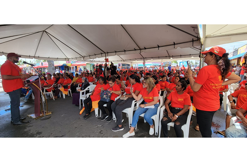 President Dr. Irfaan Ali addressing a ‘sea of red’ at the PPP/C’s public meeting at the Supenaam waterfront