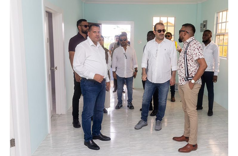 Saudi Fund for Development CEO, Sultan Abdulrahman Al-Marshad tours one of the houses being constructed by the Central Housing and Planning Authority. Also pictured is Housing and Water Minister Collin Croal (CH&PA photo)