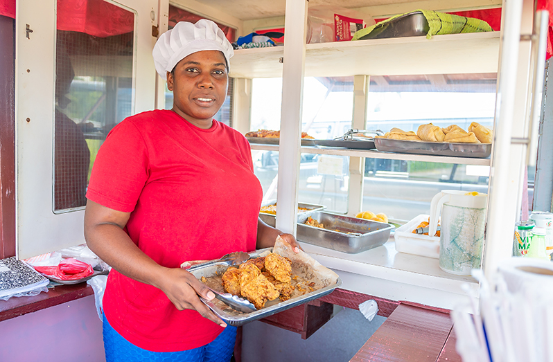 Carlene Pluck displays freshly prepared foods at her snackette (Delano Williams photos)