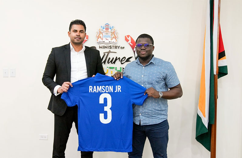 Minister of Culture, Youth and Sport, Charles Ramson Jr, receives his tournament jersey as he could feature in the celebrity match for charity on July 30,