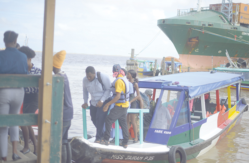 Passengers arriving at the Stabroek stelling on Tuesday morning (Japheth Savory photos)