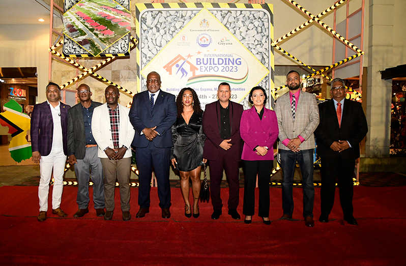 From left are: Minister within the Ministry of Public Works, Deodat Indar; Minister within the Office of the Prime Minister, Kwame McCoy; Prime Minister Brigadier (ret'd) Mark Phillips; Minister of Housing and Water, Collin Croal; Minister within the Ministry of Housing and Water, Susan Rodrigues; Permanent Secretary in the Ministry of Housing and Water, Andre Ally; Chairman of the Private Sector Commission Komal Singh and others at the launch of the exposition on Friday (Adrian Narine photo)