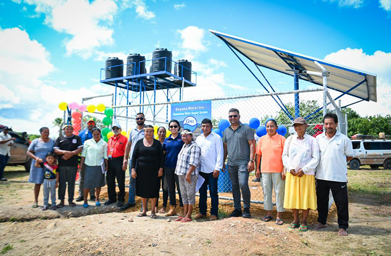 Minister Susan Rodrigues and officials with residents at the commissioning of the new water supply system (Ministry of Housing and Water photos)