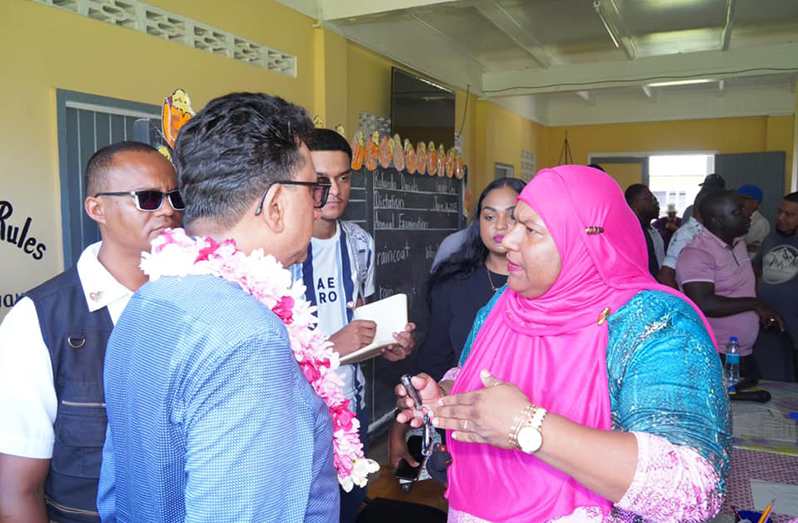 Minister of Legal Affairs and Attorney General, Anil Nandlall, interacts with residents at No. 5 Primary School on Saturday