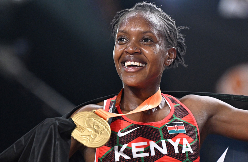 Kenya's Faith Kipyegon produced a devastating last lap to win an unprecedented third world women's 1500m title in Budapest on Tuesday.