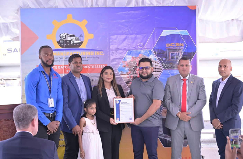 Caption: Head of GNBS Marketing, Syeid Ibrahim, handed over the Certficate to DCSN Director, Chaitanya Jagmohan (centre). Also in photo are Minister of Housing and Water, Collin Croal and Vice President of GMSA, Rafeek Khan