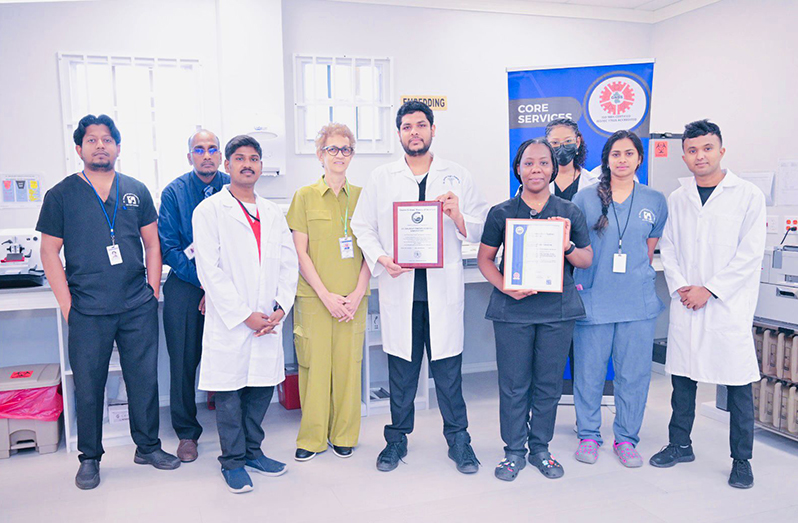 CEO of the Dr. Balwant Singh Hospital, Dr Madhu Singh, with staff of the laboratory