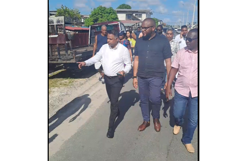 Minister within the Ministry of Public Works, Deodat Indar, during his walk-through in Albouystown