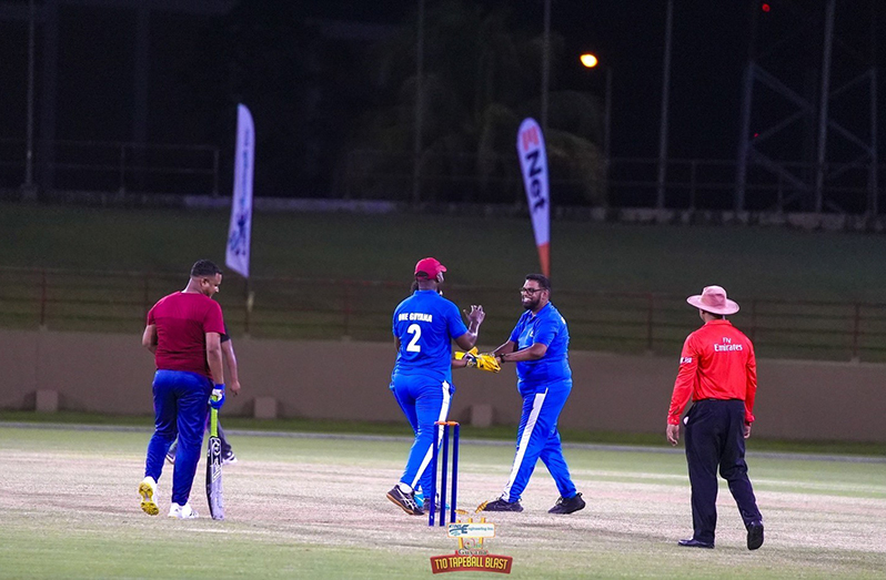 President Dr. Irfaan Ali in all smiles after taking a wicket