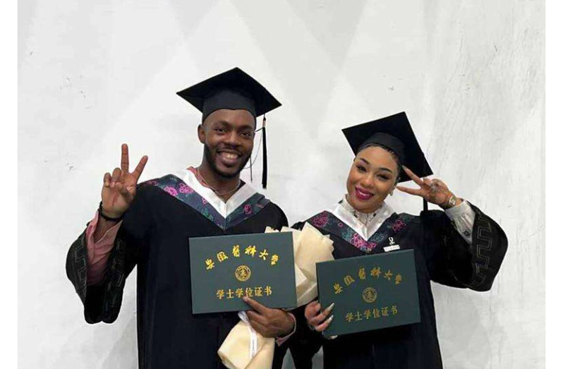 Dr Doniel Bowen poses for a photograph with fellow Jamaican Candice Sommerville after their graduation from Anhui Medical University