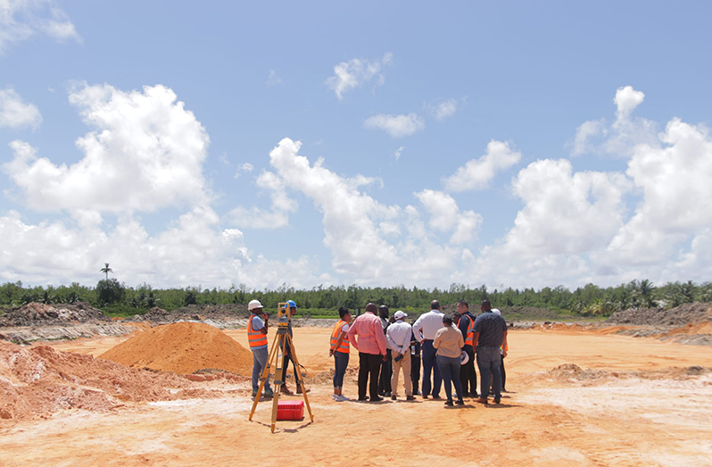 Minister of Health Dr. Frank Anthony (centre) and other officials being briefed at the construction site for the Lima Regional Hospital in Region Two