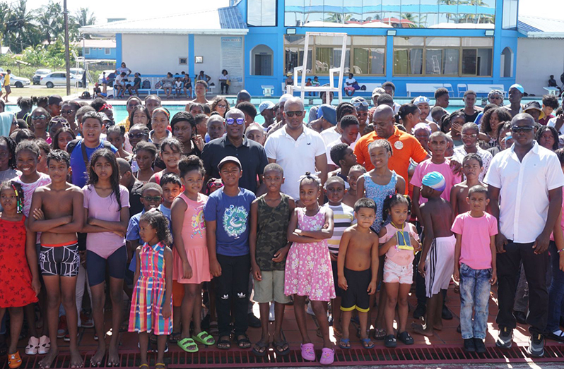 Officials and participants of the August Vacation swim programme take a photo-op (Emmerson Campbell photo)