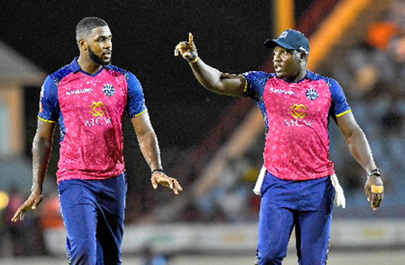 Barbados Royals captain Rovman Powell gives instructions to young left-arm seamer, Obed McCoy, during Thursday night’s defeat to St Lucia Kings (Photo by CPLT20/Getty Image)