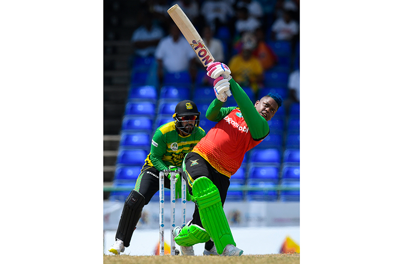 Shimron Hetmyer (R) of Guyana Amazon Warriors hits 6 and Amir Jangoo (L) of Jamaica Tallawahs watch during the Men's 2023 Republic Bank Caribbean Premier League match 11 between Jamaica Tallawahs and Guyana Amazon Warriors at Warner Park Sporting Complex on August 27, 2023 in Basseterre, Saint Kitts and Nevis. (Photo by Randy Brooks/CPL T20 via Getty Images)