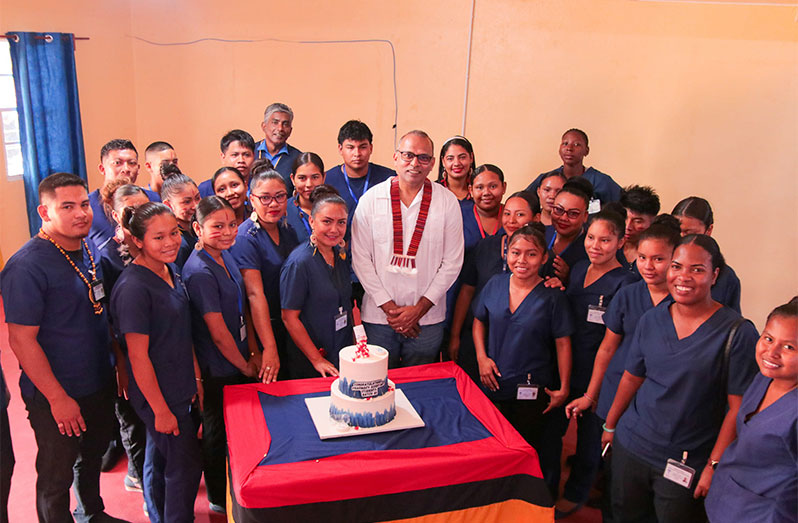 Minister of Health, Dr. Frank Anthony flanked by the first batch to be trained as pharmacy assistants in Region Nine