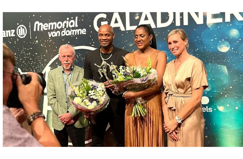 Powell and Perec with their flowers following their induction into the Memorial Van Damme Hall of Fame on Thursday.