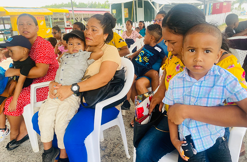 Parents and children during the Child Health Screening at the at the Anna Regina car park