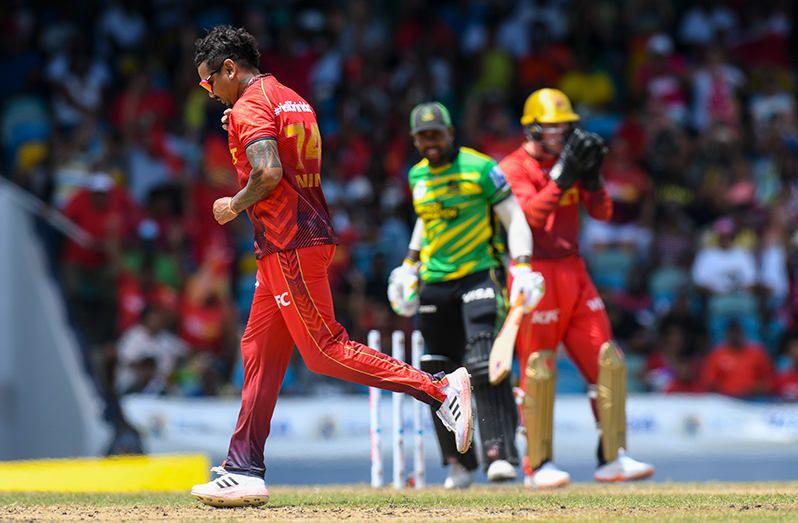 Sunil Narine (L) of Trinbago Knight Riders celebrates the dismissal of Fabian Allen (R) of Jamaica Tallawahs during the Men's 2023 Republic Bank Caribbean Premier League match 17 between Jamaica Tallawahs and Trinbago Knight Riders at Kensington Oval on September 3, 2023 in Bridgetown, Barbados. (Photo by Randy Brooks/CPL T20 via Getty Images)