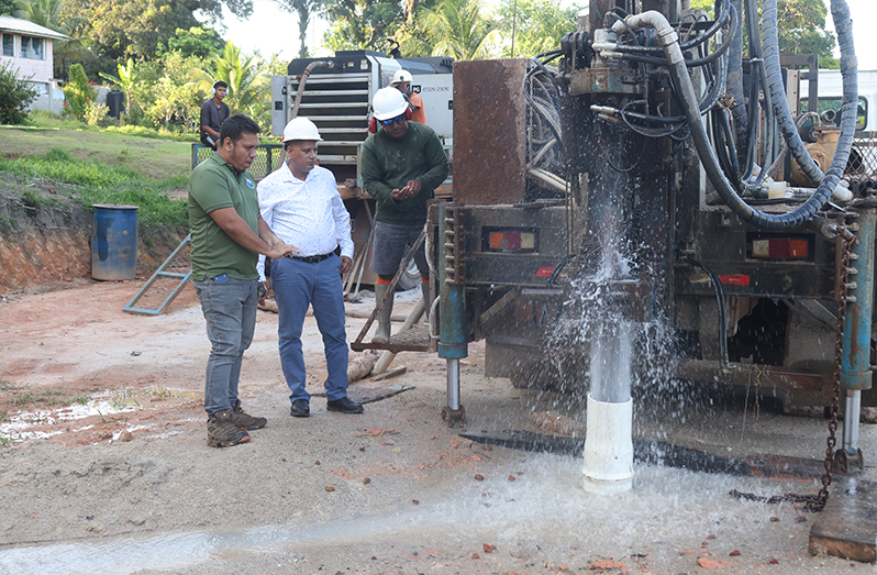 Minister of Housing and Water, Collin Croal, at the well site on Friday