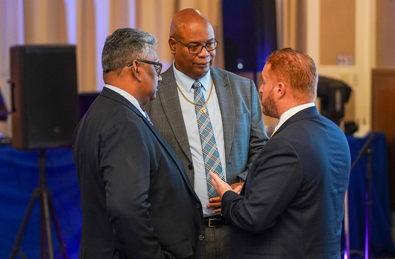 Minister of Public Works, Juan Edghill (middle), Chairman of the PSC, Komal Singh (left) and Chief Executive of the ANSA Group, Anthony Sabga III interacting at the launch of ANSA Building Solutions