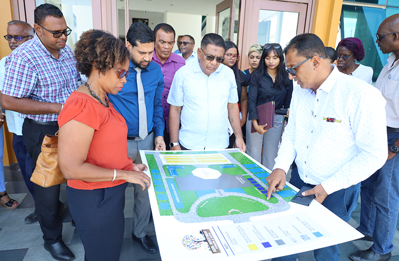 Agriculture Minister Zulfikar Mustapha and other officials at ACCC examining the site map