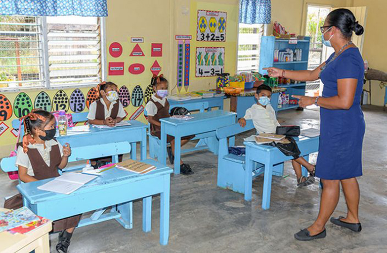 Teacher Joycelyn Joseph during a lesson with her nursery school children during the COVID-19 pandemic (Delano Williams photo)