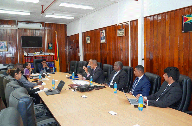 Attorney General and Minister of Legal Affairs, Mohabir Anil Nandlall SC, (head of the table) with members of his team along with the Executive Members from the Guyana Bar Association