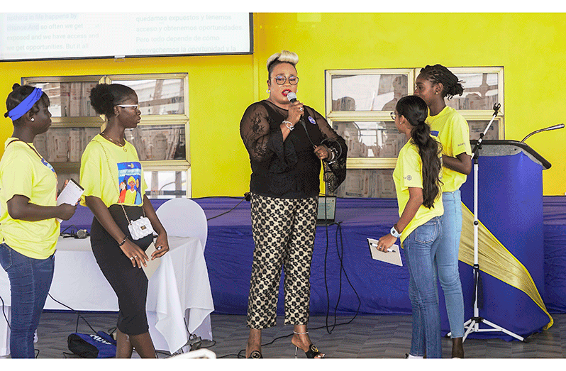 Eldri Ferguson-Mackey, Director of Marketing and Merchandising, engages participants in an interactive session on empowerment