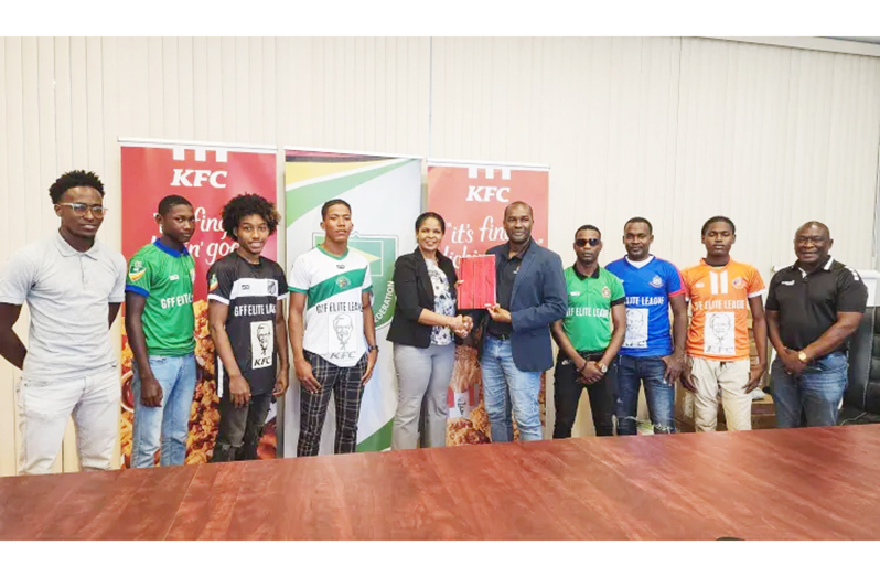 At centre are GFF President Wayne Forde and KFC Guyana Marketing Manager Pamella Manasseh, along with team representatives and officials at the launch on Wednesday