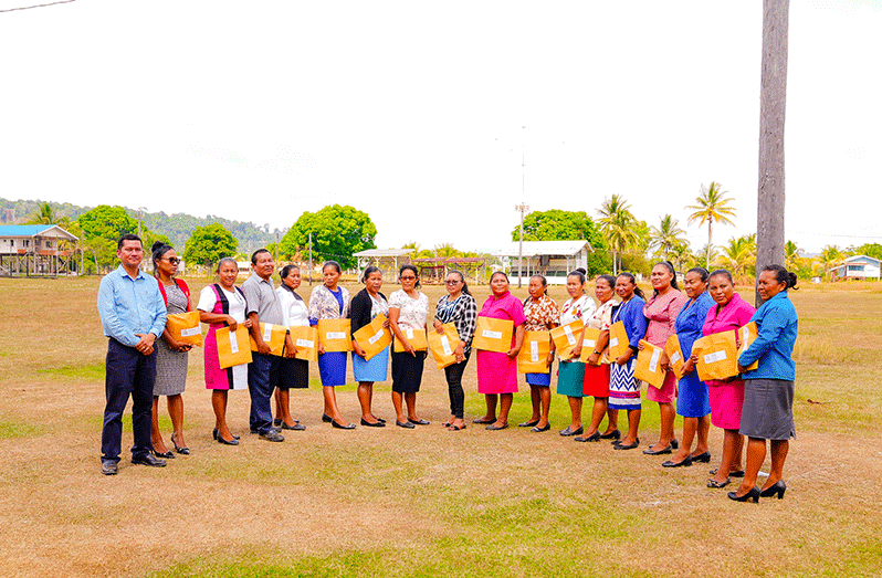 Deputy Chief Education Officer with responsibility for Amerindian Hinterland Education Development, Mr. Marti DeSouza (first from left) with headteachers of nursery, primary, and secondary schools in Region Seven that received the grant